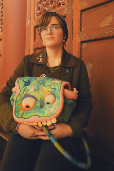 Zoe holding felted bag